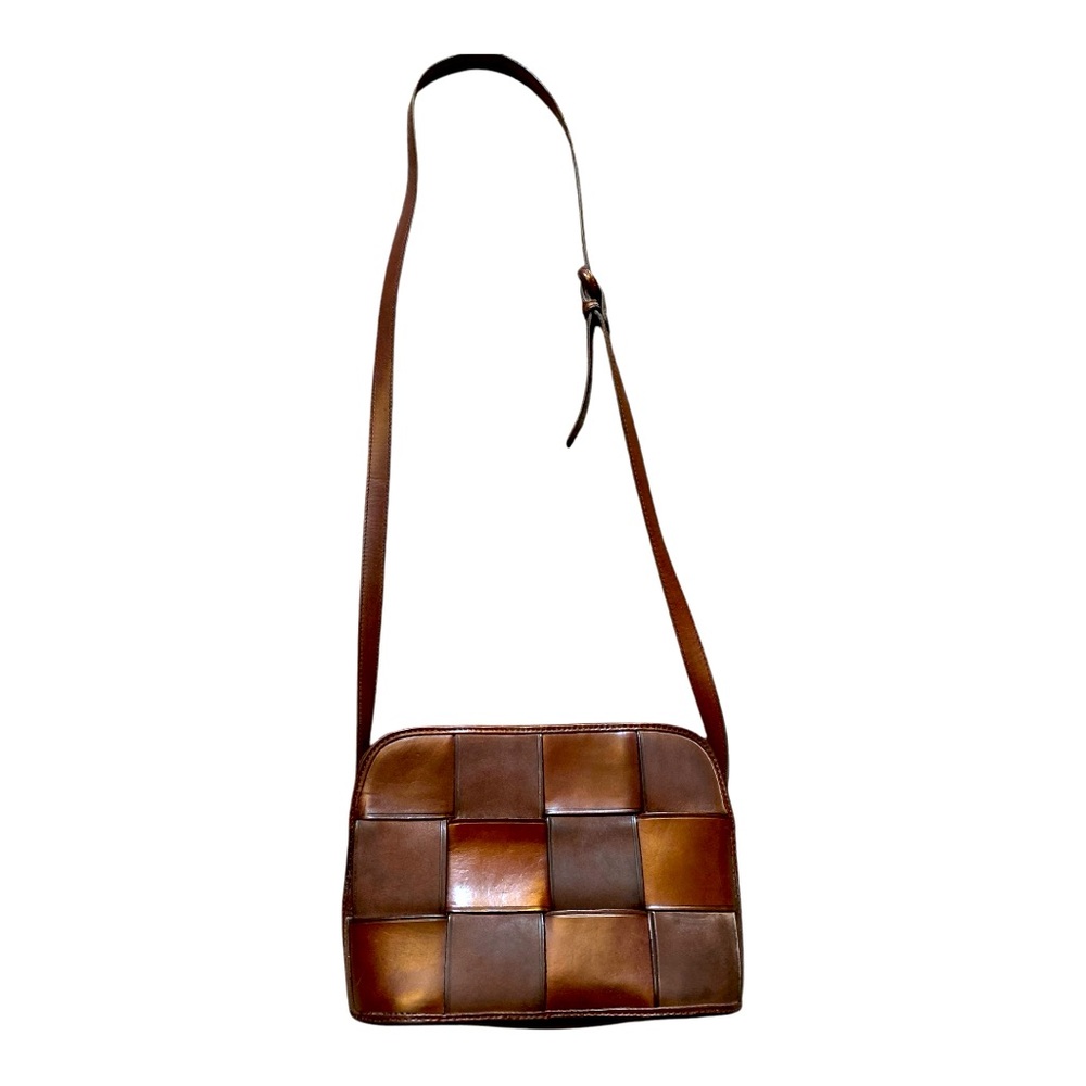 Vintage Paradox Leather Weave Crossbody Bucket Bag with adjustable strap.